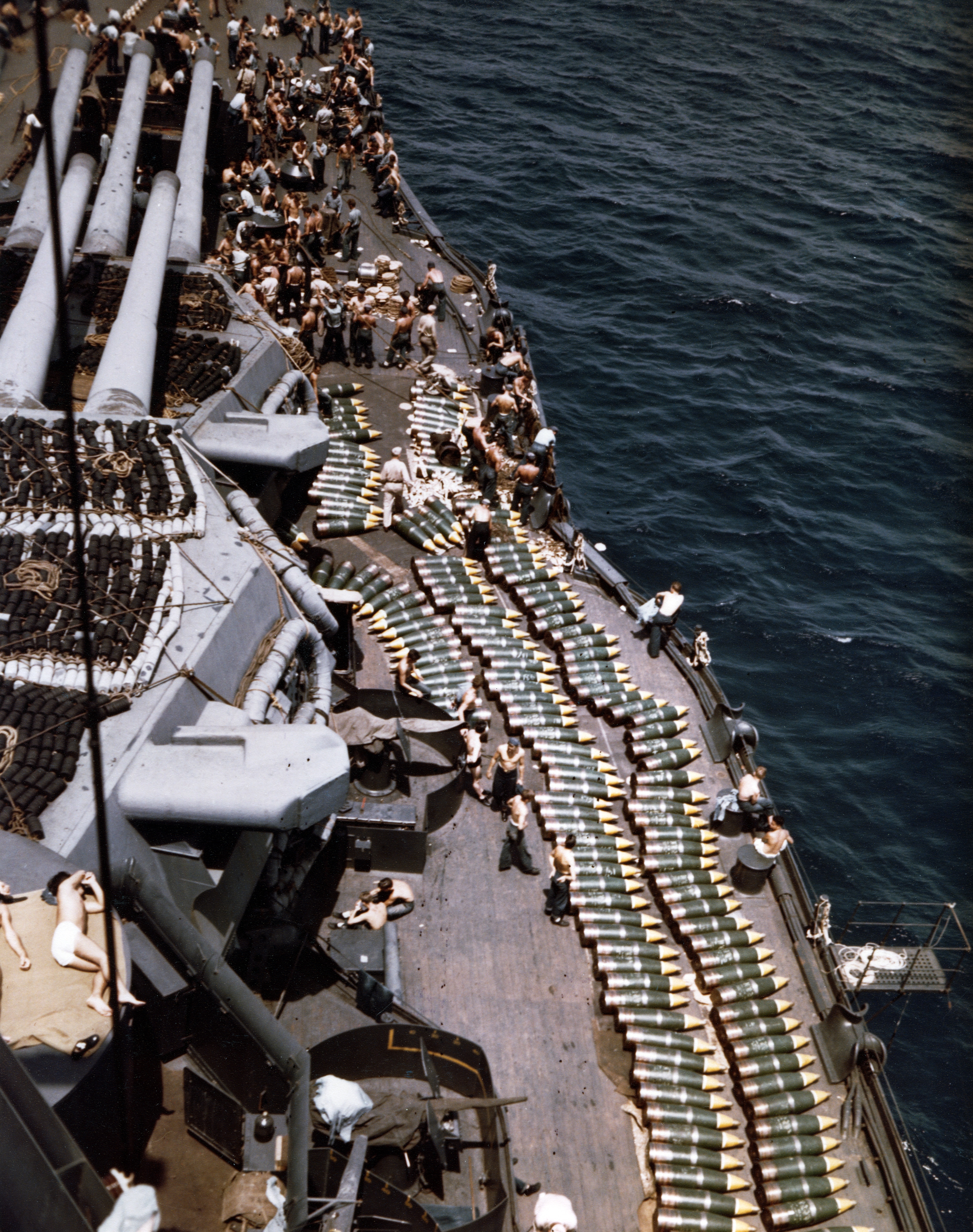 USS New Mexico's 14-inch projectiles on starboard deck forward while being replenished at Eniwetok, Marshall Islands 30 Jun 1944 prior to the invasion of Guam
