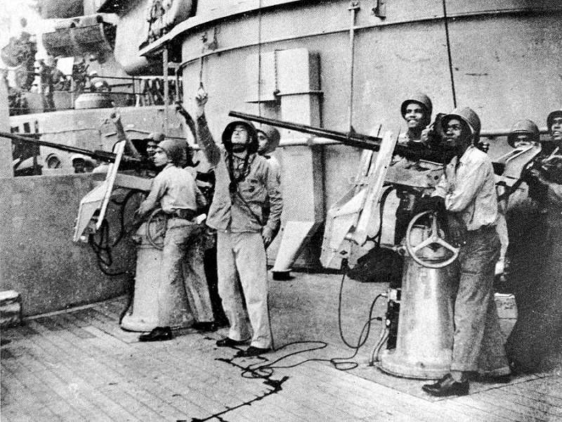 20mm Oerlikon crews at the base of one of the main turrets aboard USS North Carolina, 1942; note African-American crewmen