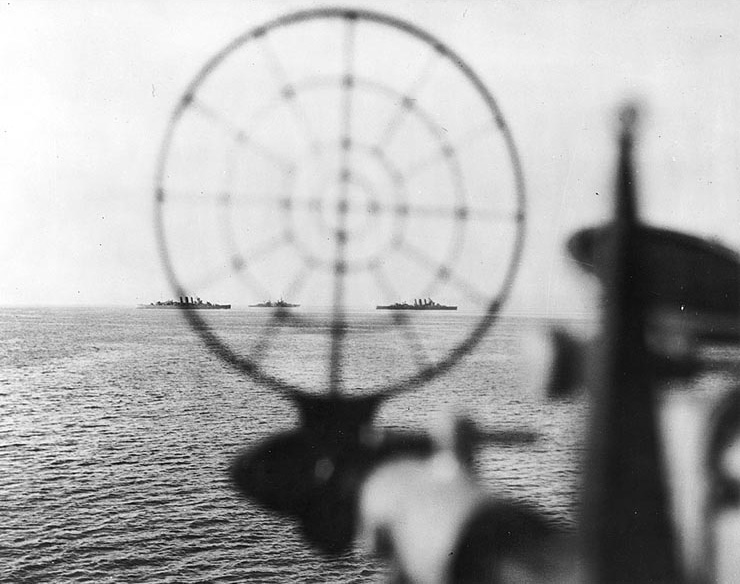Australian heavy cruisers Shropshire and Australia seen through a gunsight of American cruiser Phoenix, off Leyte, Philippine Islands, 21 Oct 1944