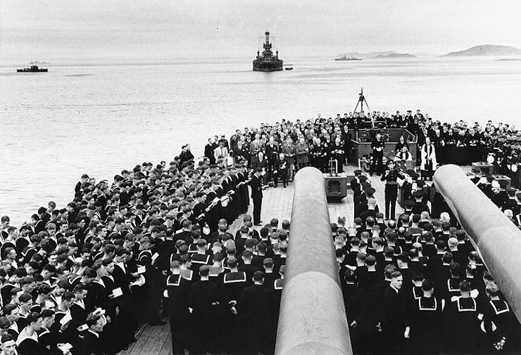 Religious service on board HMS Prince of Wales during Atlantic Charter Conference, Placentia Bay, Newfoundland, 10 Aug 1941; note Roosevelt, Churchill, King, Marshall, Dill, Stark, and Pound in presence; USS Arkansas in background