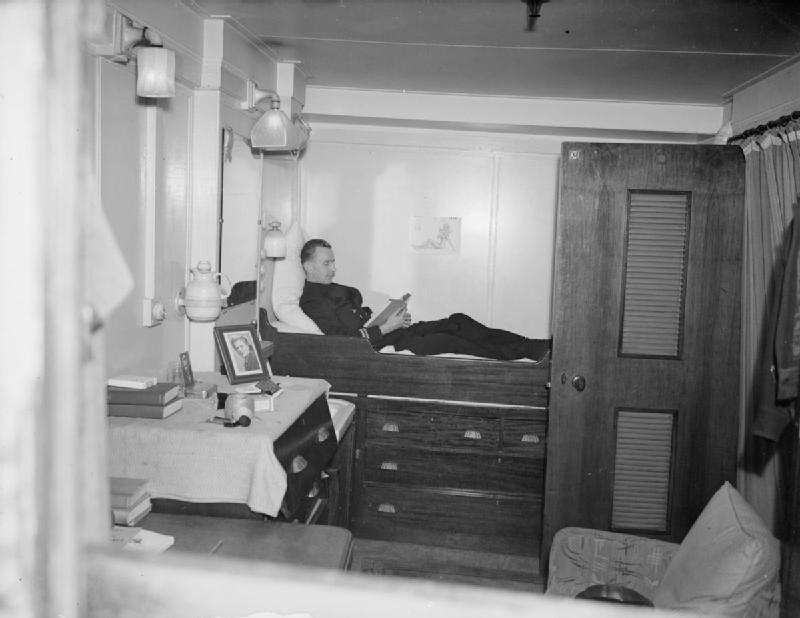 Assistant troop officer Munrom resting in the Third Officer's Cabin aboard RMS Queen Mary, 1944