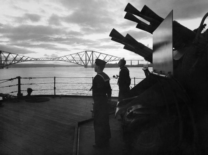 View of 2-pdr gun and two sailors aboard HMS Rodney, Firth of Forth, Scotland, United Kingdom, Oct 1940