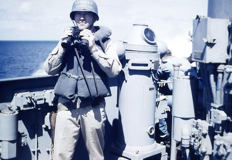 Lieutenant Howard W. Whalen holding binoculars aboard USS Sanborn, 1945, photo 2 of 2