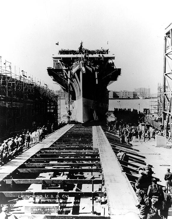 San Jacinto sliding down the building ways at Camden, New Jersey, United States after she was christened by Mrs. Jesse H. Jones, 26 Sep 1943