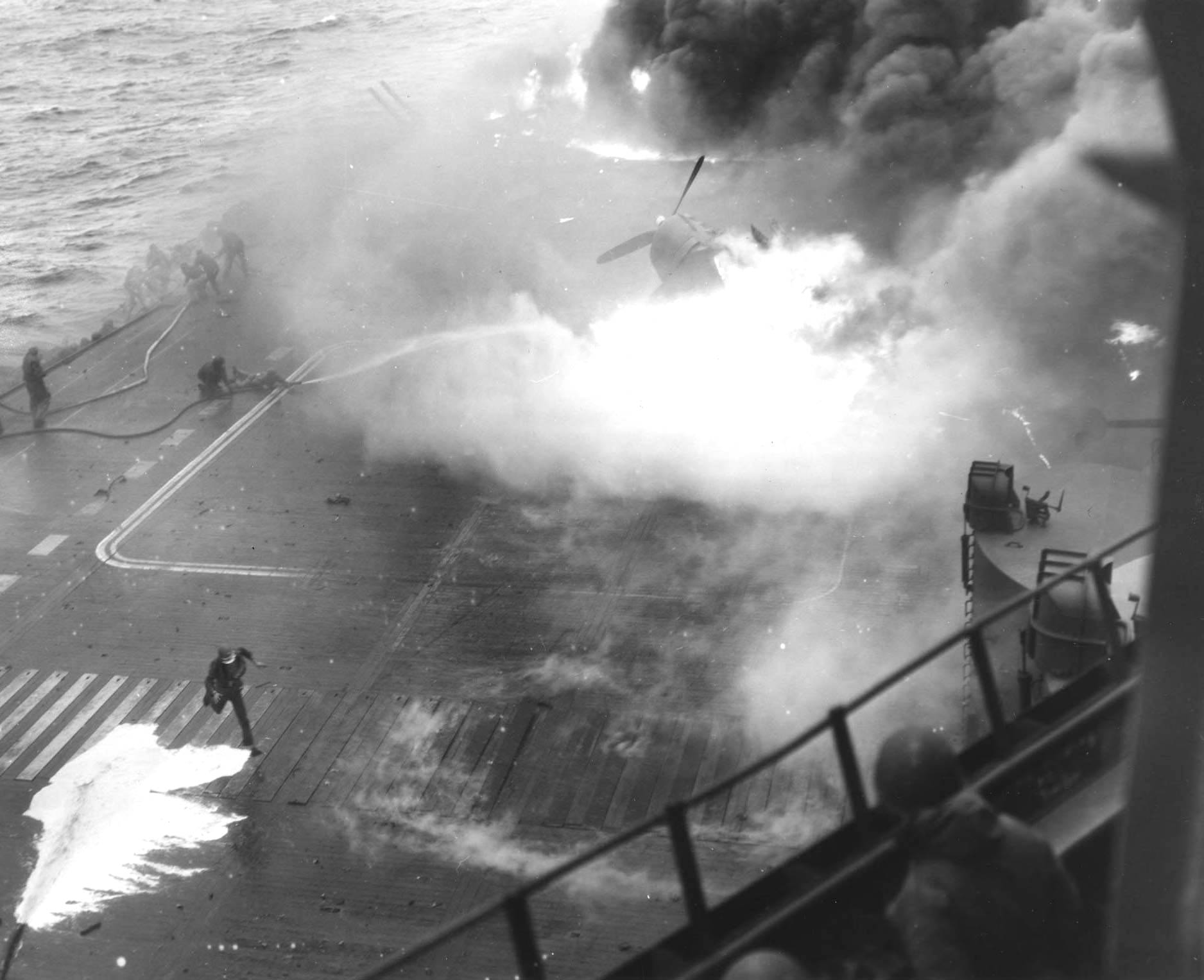 Following an attack from Japanese special attack aircraft, fires grew in the forward hangar deck of USS Saratoga off Iwo Jima, 21 Feb 1945. The fires increased greatly before they could be controlled. Photo 3 of 3