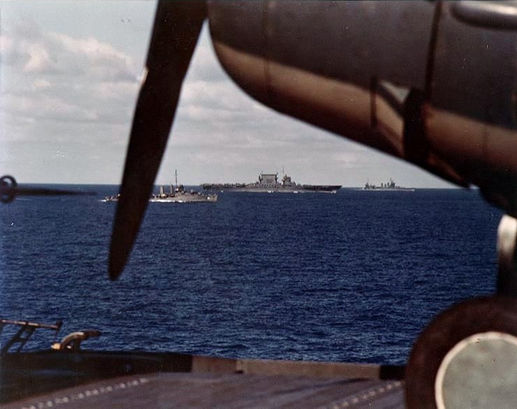 US fleet sailing toward Guadalcanal, Solomon Islands, early Aug 1942; note USS Saratoga at center, New Orleans-class heavy cruiser in background, USS Enterprise in foreground
