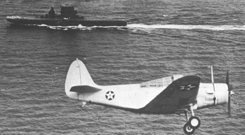 TBD-1 Devastator aircraft on landing pattern, Oct 1941; note USS Saratoga, the aircraft's destination, in background
