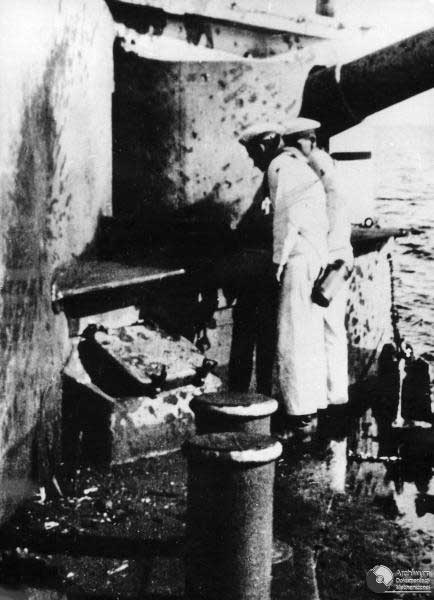 Sailors inspected damage on Schleswig-Holstein caused by Polish coastal batteries of Hel Penninsula, Sep 1939