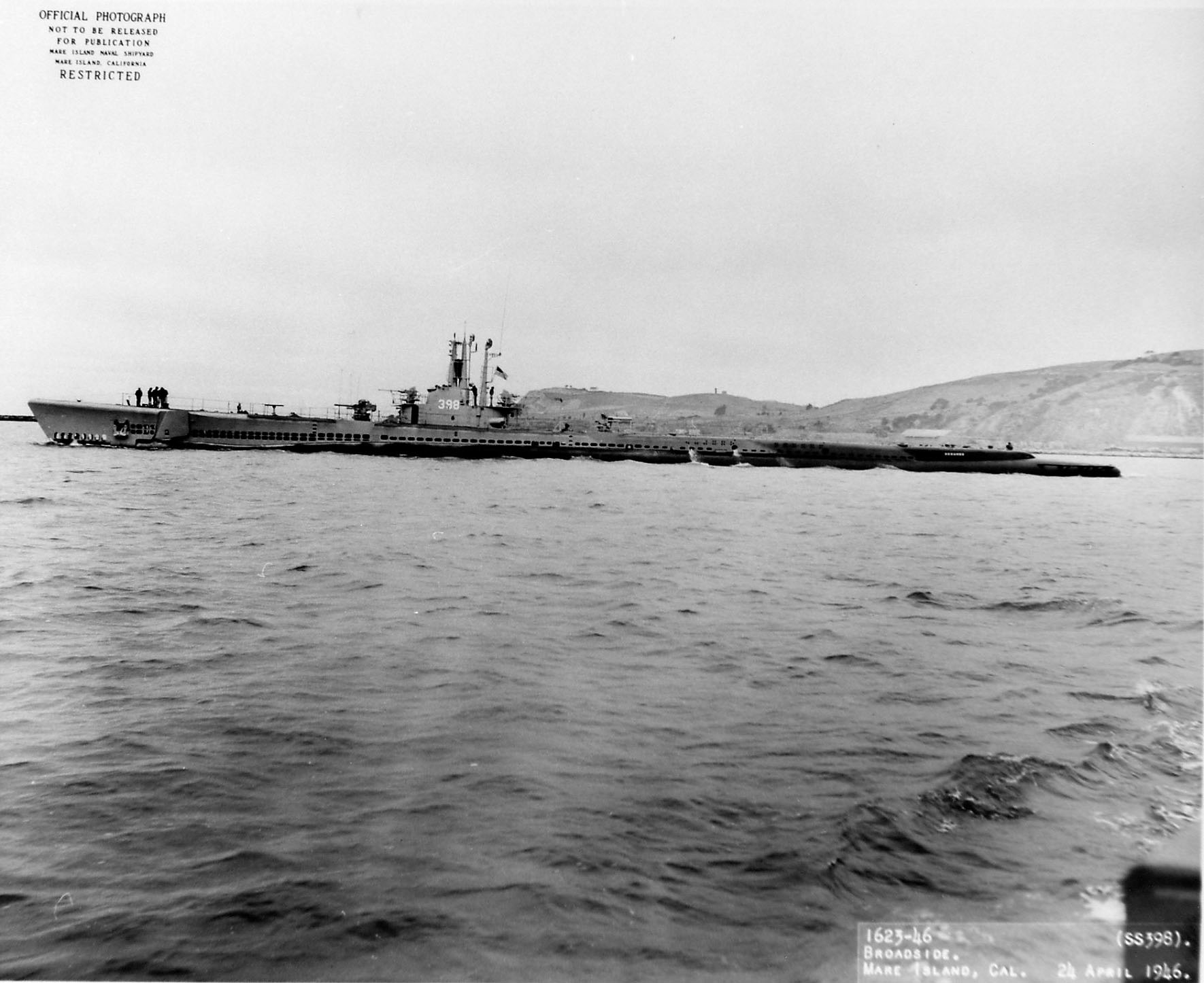 Broadside view of USS Segundo departing Mare Island Naval Shipyard, California, United States, 24 Apr 1946, photo 1 of 2