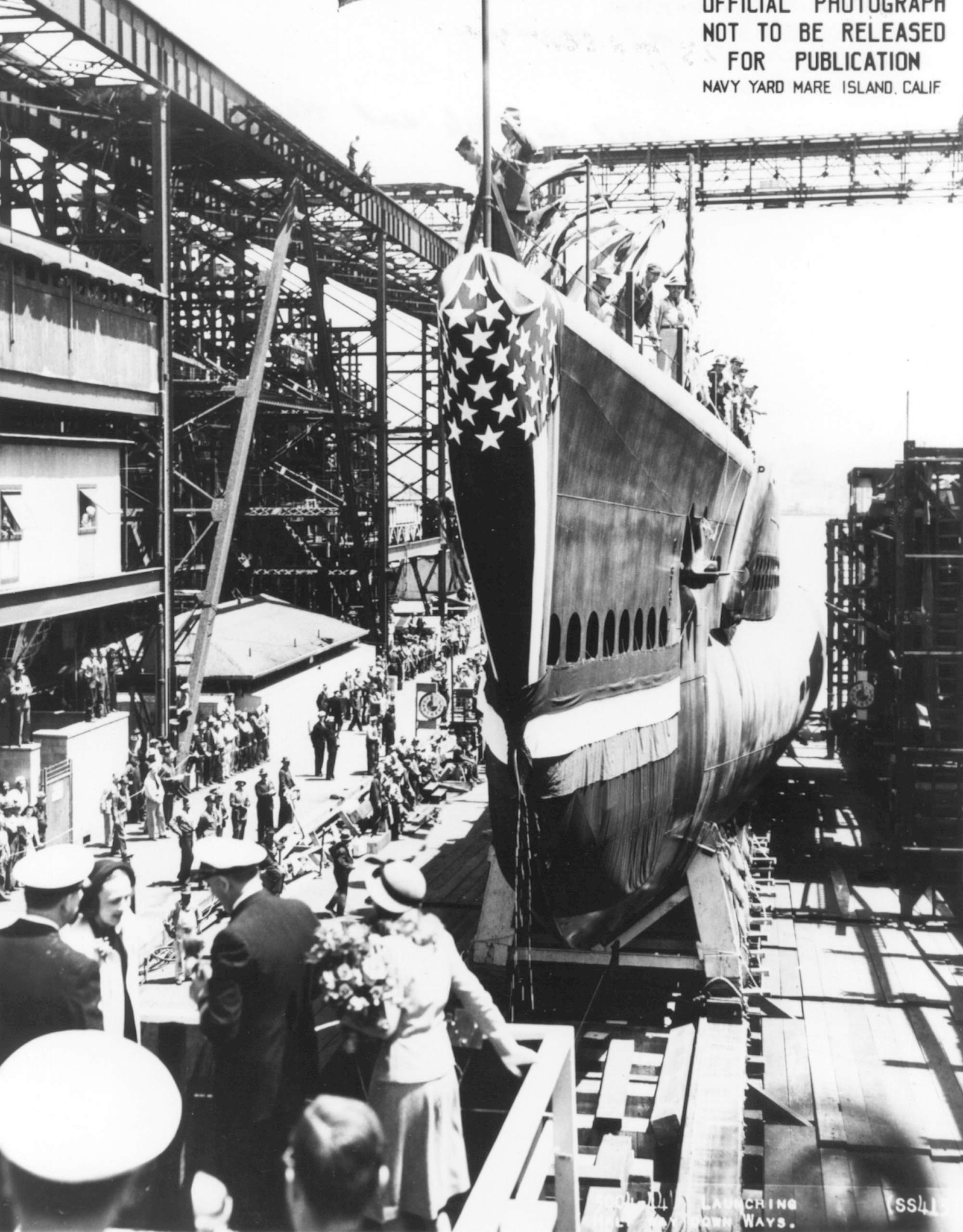 Launching of submarine Spot, Mare Island Naval Shipyard, Vallejo, California, United States, 19 May 1944; note Mrs. Tisdale, RAdm E L Cochrane, Mrs. Gieselmann, RAdm M S Tisdale, Jean Gieselmann, Capt A O Gieselmann, Mrs. Klein, Capt G C Klein