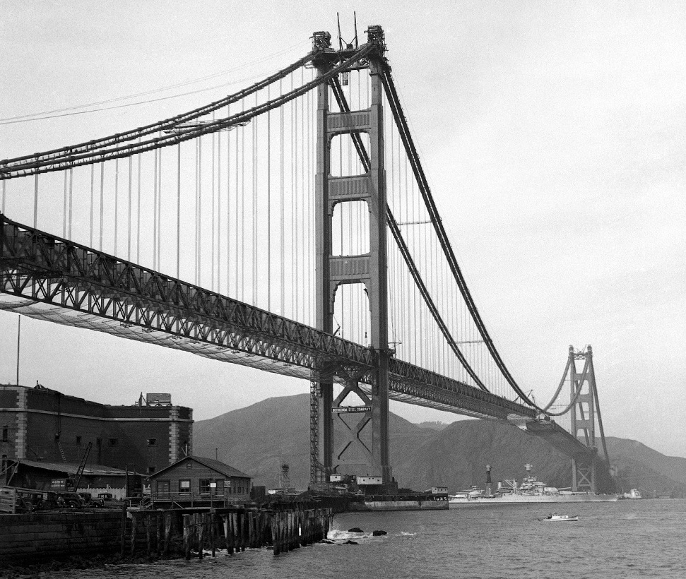 Tennessee-class battleship entering San Francisco Bay under the nearly completed Golden Gate Bridge on her way to attend the opening of the Oakland Bay Bridge, California, United States, 12 Nov 1936