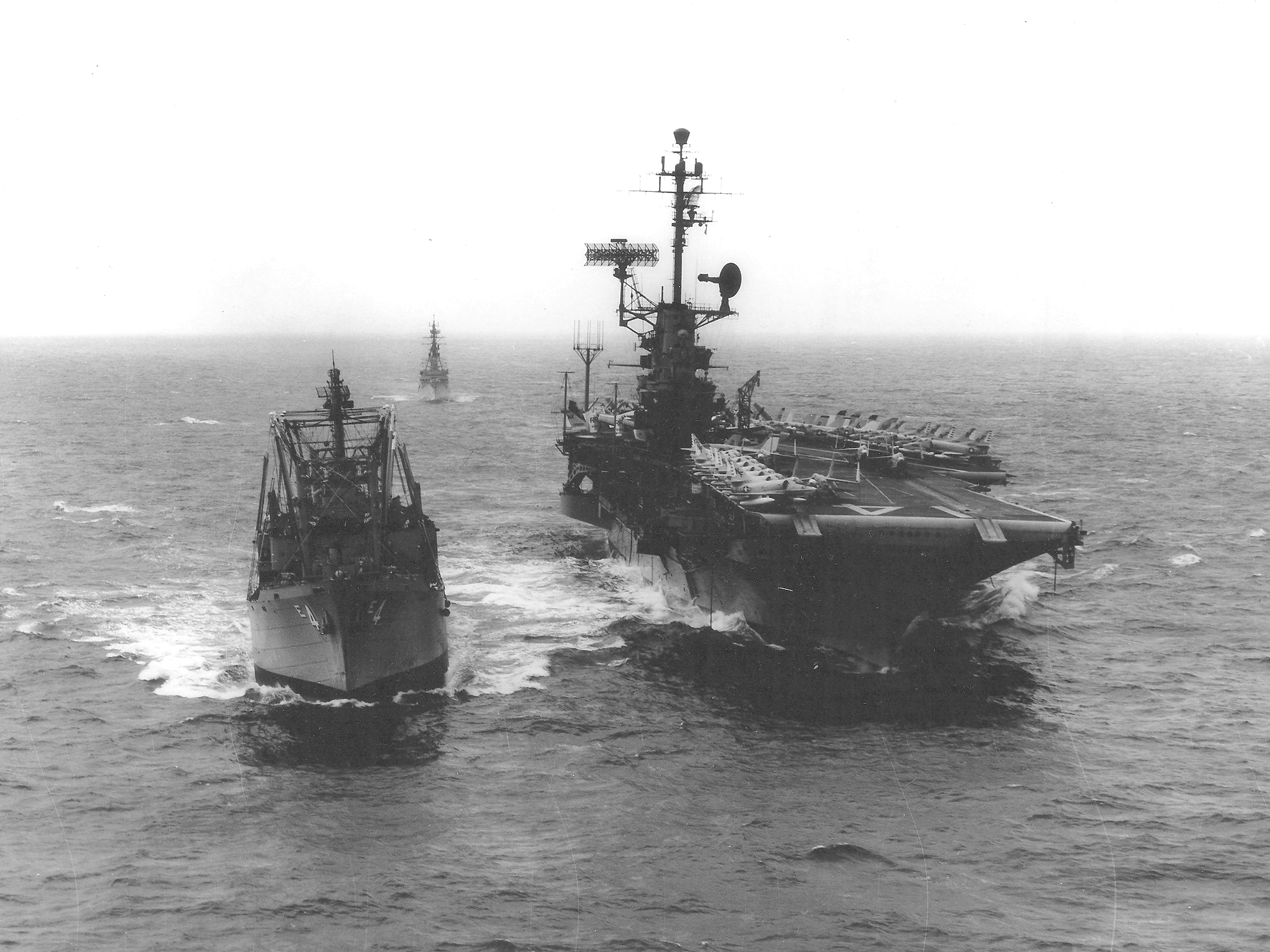 Ammunition ship USS Mount Baker replenishing carrier USS Ticonderoga, off California, United States, 2 Sep 1965