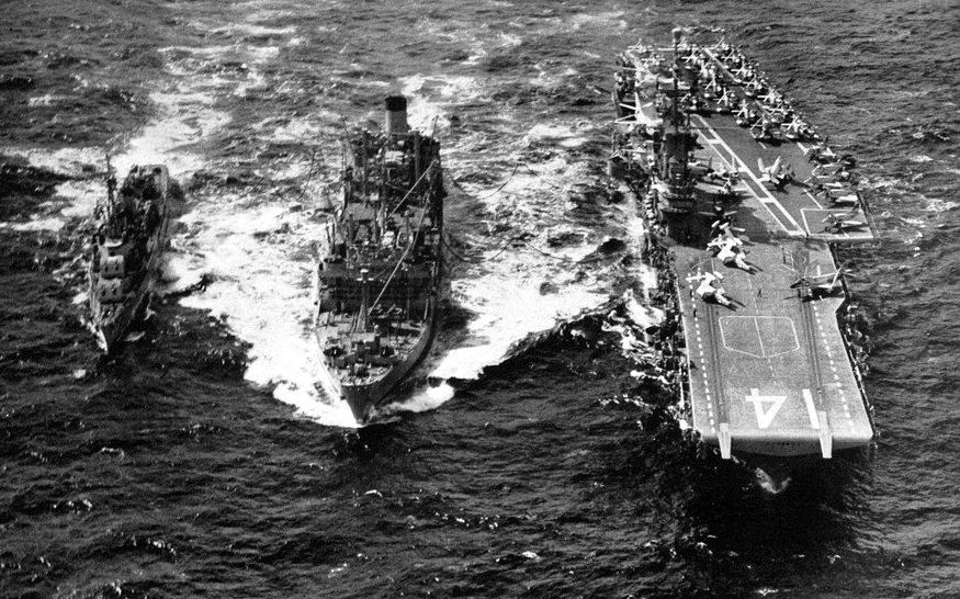 USS Ticonderoga and a destroyer receiving fuel from an oiler, circa 1957