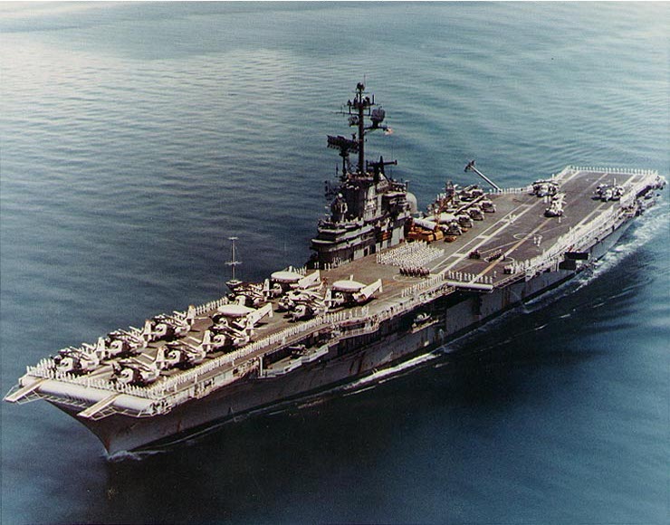 Anti-submarine warfare carrier Ticonderoga with her rails manned, Sunda Strait, 24 Apr 1971