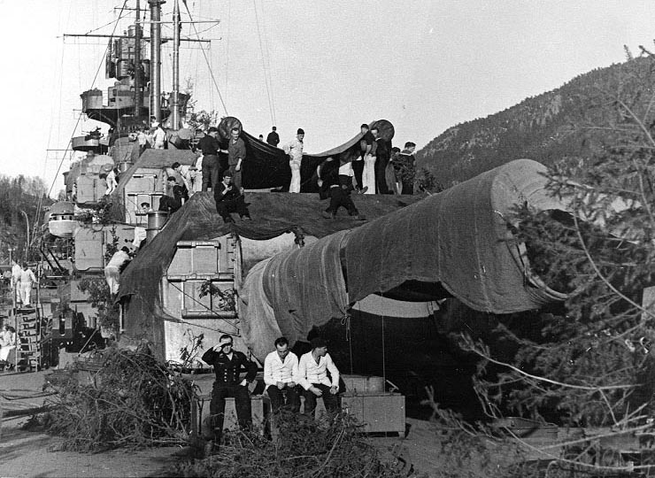 Sailors camouflaging the Tirpitz in a Norwegian fjord