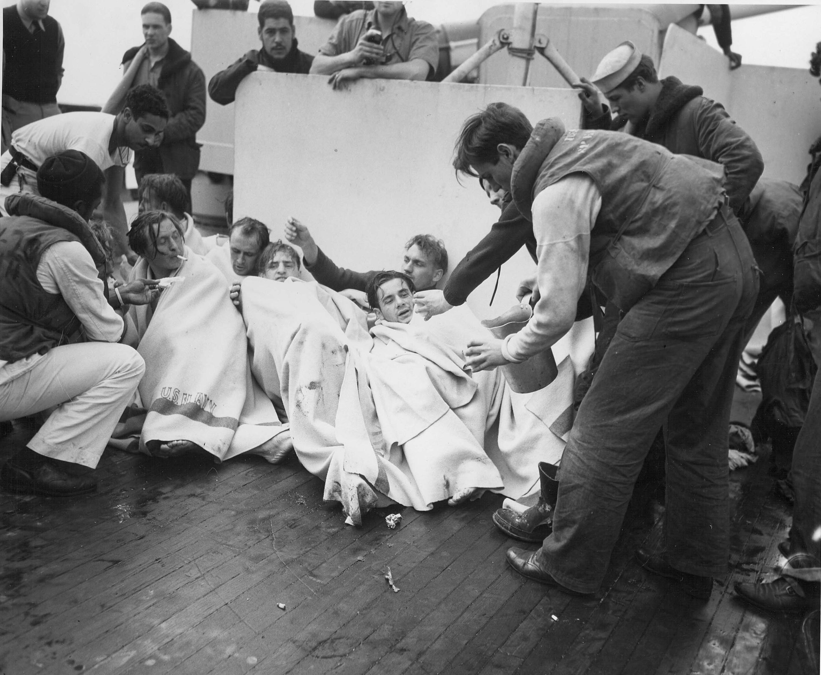 Crew of USS Spencer cared for rescued U-175 sailors, North Atlantic, 500 nautical miles WSW of Ireland, 17 Apr 1943, photo 2 of 2