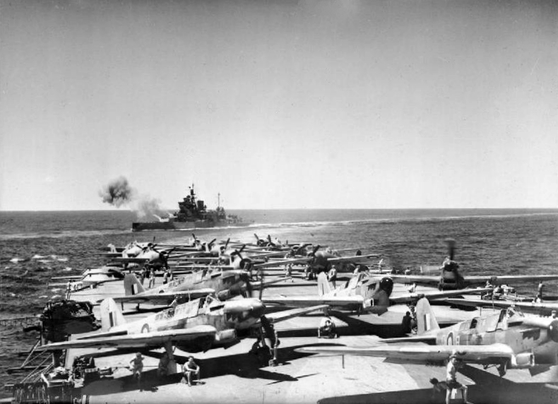 HMS Valiant firing in exercise, 1942; HMS Illustrious with Fulmar and Martlet aircraft in foreground