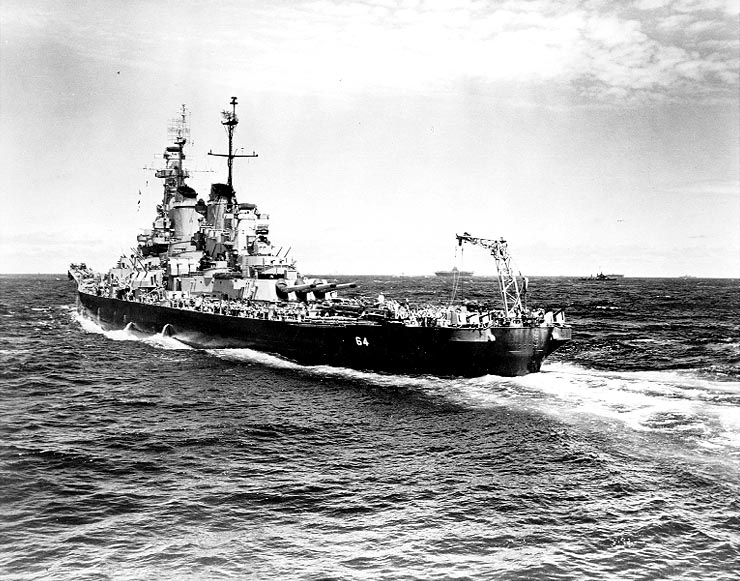 USS Wisconsin in the western Pacific Ocean, circa Dec 1944-Aug 1945; note Essex-class carrier in background