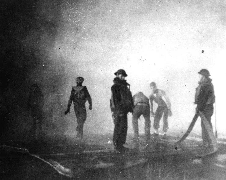 Firefighters in Yorktown's hangar, just after noon, 4 Jun 1942
