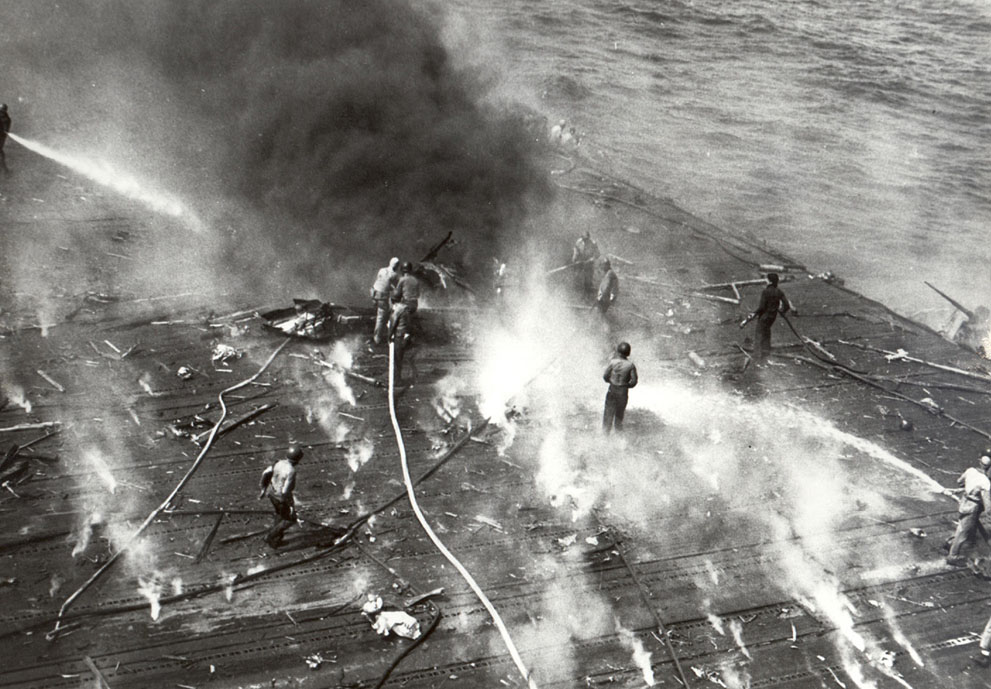 Crew of USS Yorktown fighting a fire during the Battle of Midway, 4 Jun 1942
