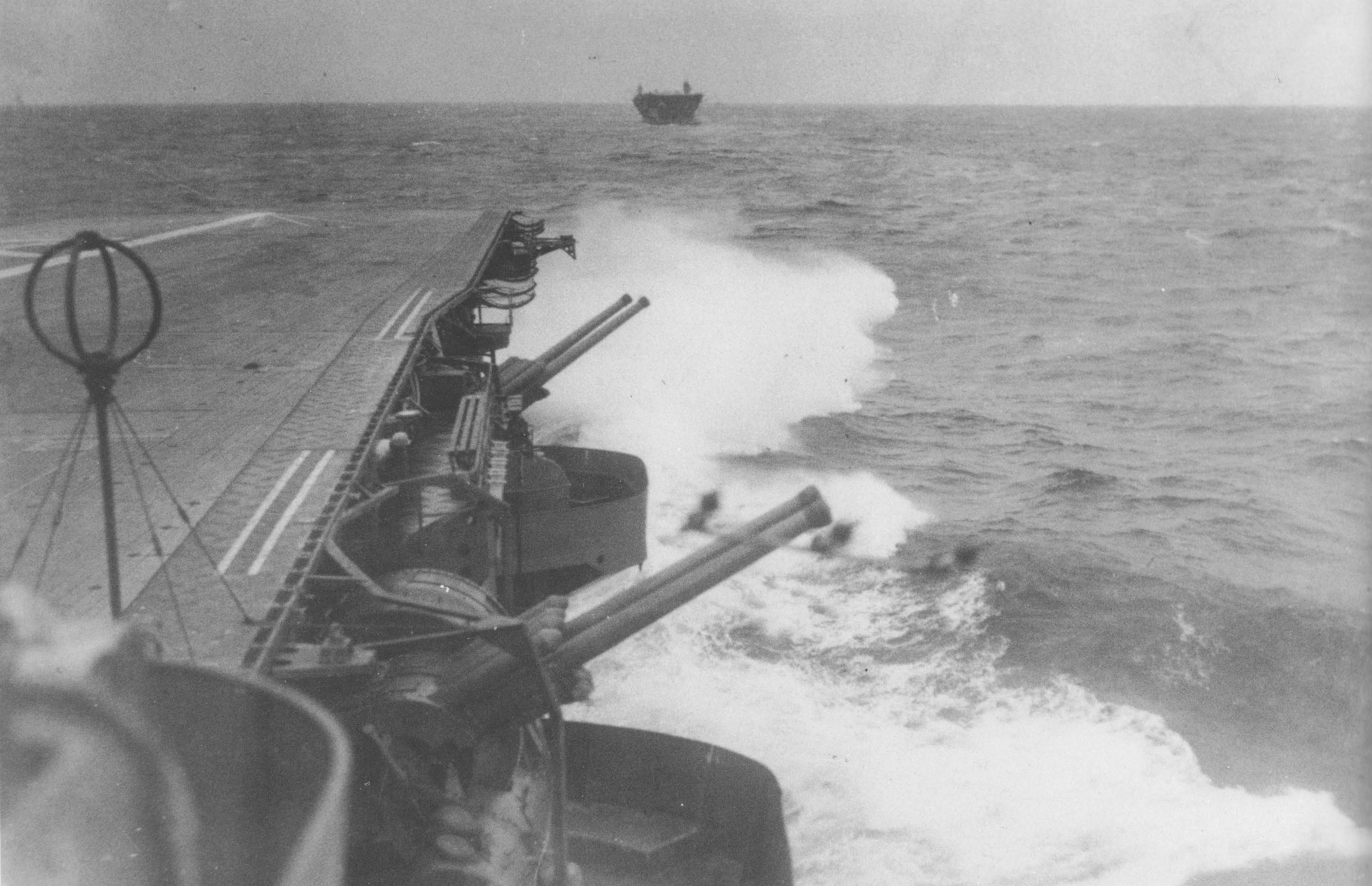 Japanese carriers Zuikaku (foreground) and Kaga (background) underway toward Hitokappu Bay, Iturup, Kurile Islands, Nov 1941; note Zuikaku's anti-aircraft armament