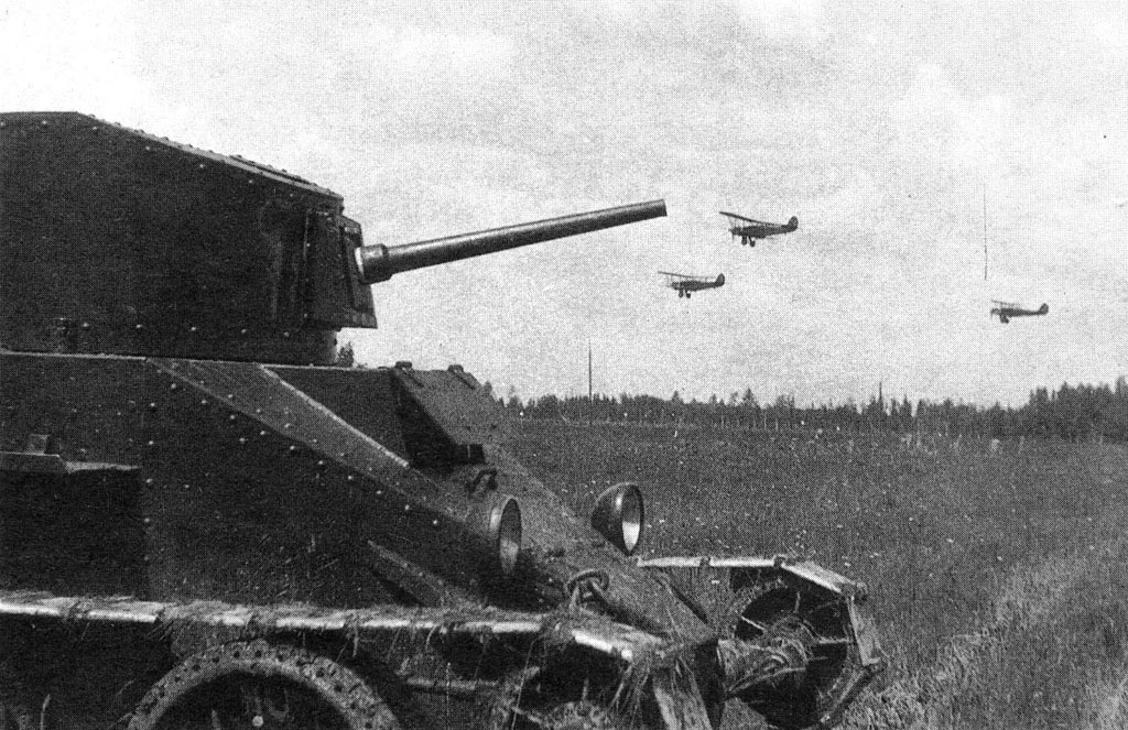 BT-2 tank with 35mm gun at rest, circa 1930s; note Polikarpov R-5 reconnaissance aircraft in background