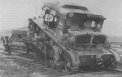 C7P artillery towing vehicle being loaded onto a rail car, Poland, circa 1930s