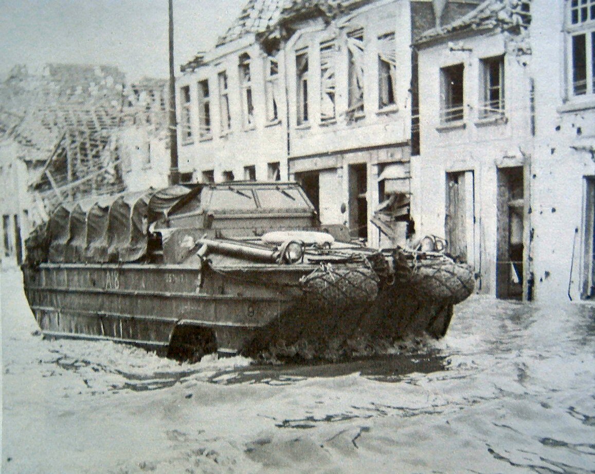 US Army DUKW moving through a flooded town, the Netherlands, 1944