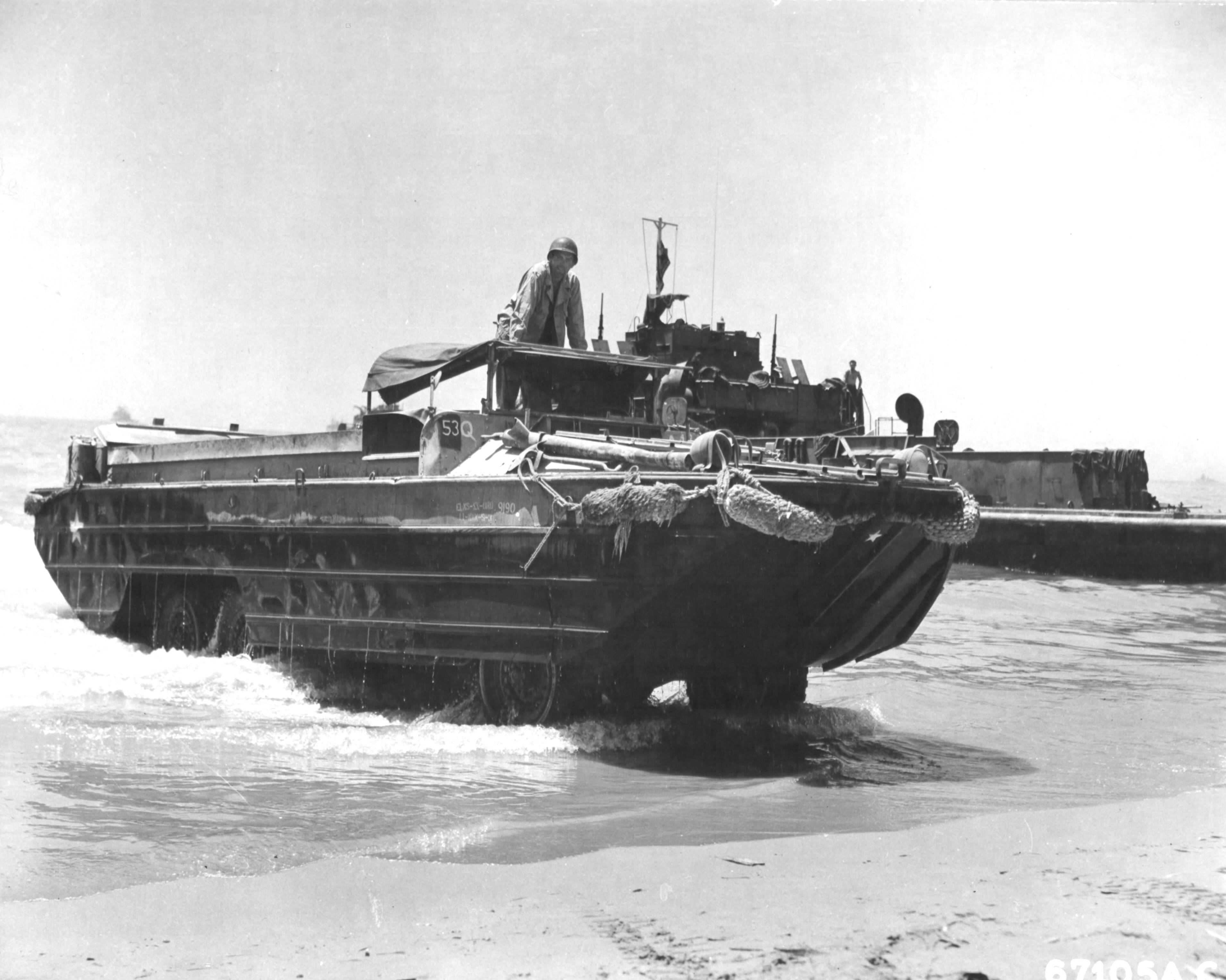 US Army DUKW loaded with oil drums coming ashore at Gela, Sicily, Italy, Jul 1943