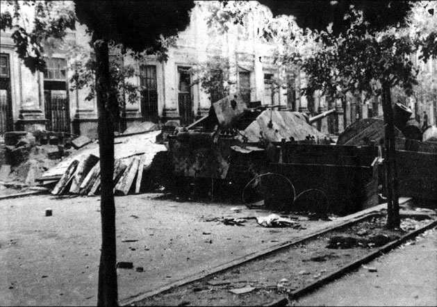 Polish barricade at Napoleon Square, Warsaw, Poland, 3 Aug 1944, photo 3 of 4; note captured Jagdpanzer 38(t) tank destroyer as part of barricade