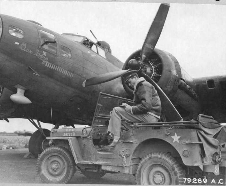 B-17F Flying Fortress bomber 'Our Gang' of US 8th Air Force, 91st Bomb Group, 324th Bombing Squadron at Bassingbourn, England, United Kingdom, Jun or Jul 1943; note Jeep with fuel tank under driver