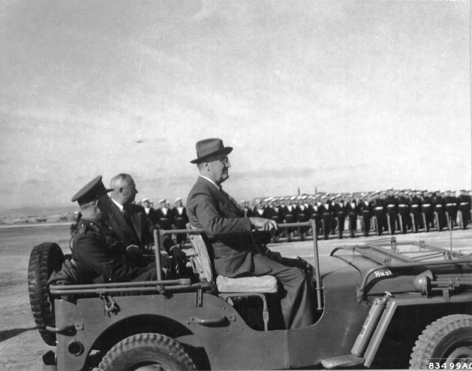 US President Franklin D Roosevelt surveying troops on Malta in Dwight Eisenhower's personal Jeep 'Husky', 2 Feb 1945; note special modification that allowed Roosevelt to sit straight and tall
