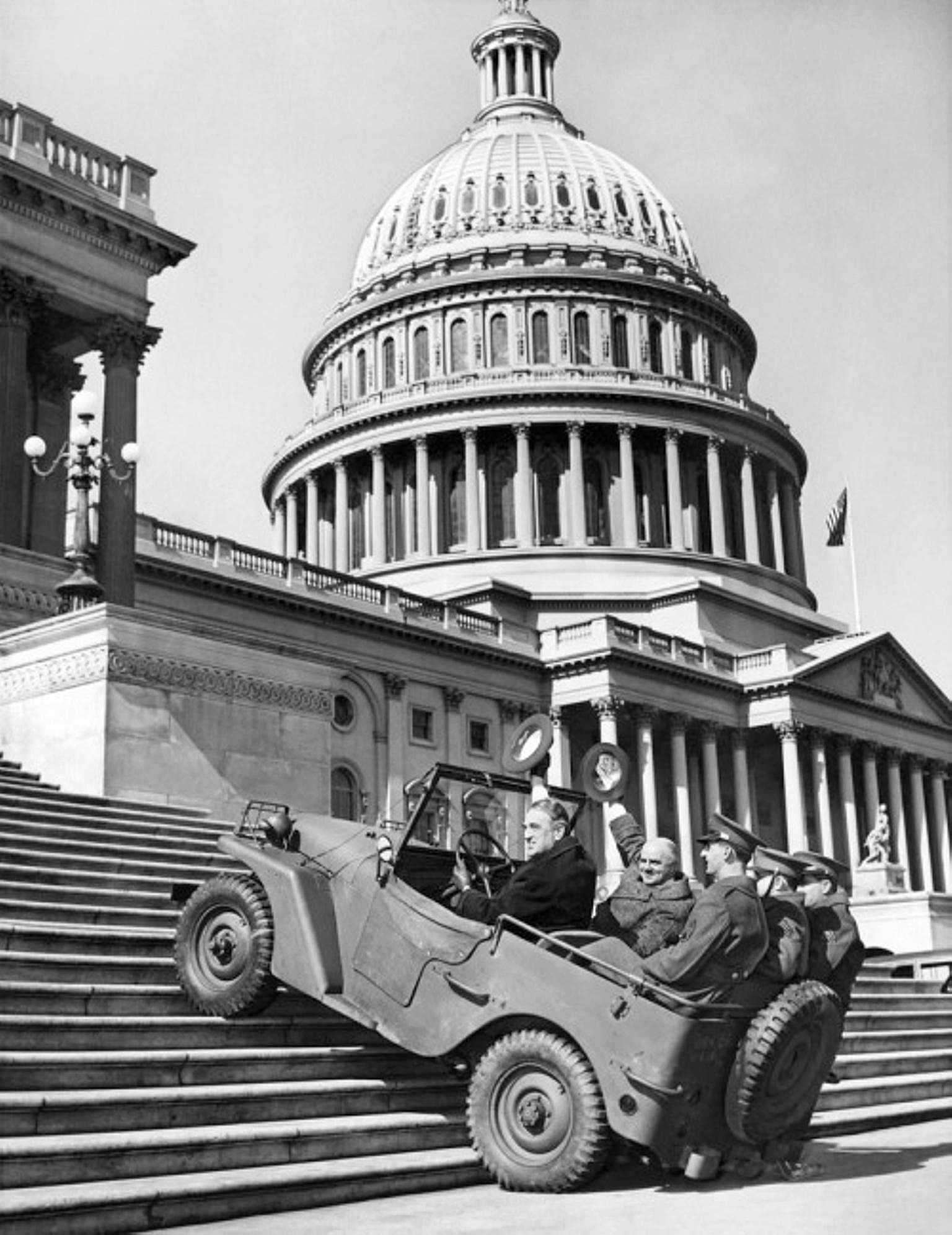 US Senators Meade and Thomas riding a Willys Quad as it climbed steps in front of the US Congress building, Washington, DC, United States, seen on 20 Feb 1941 issue of newspaper Washington Daily News