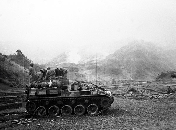 A M19 Twin 40mm Gun Motor Carriage firing at a Chinese position in Korea, date unknown
