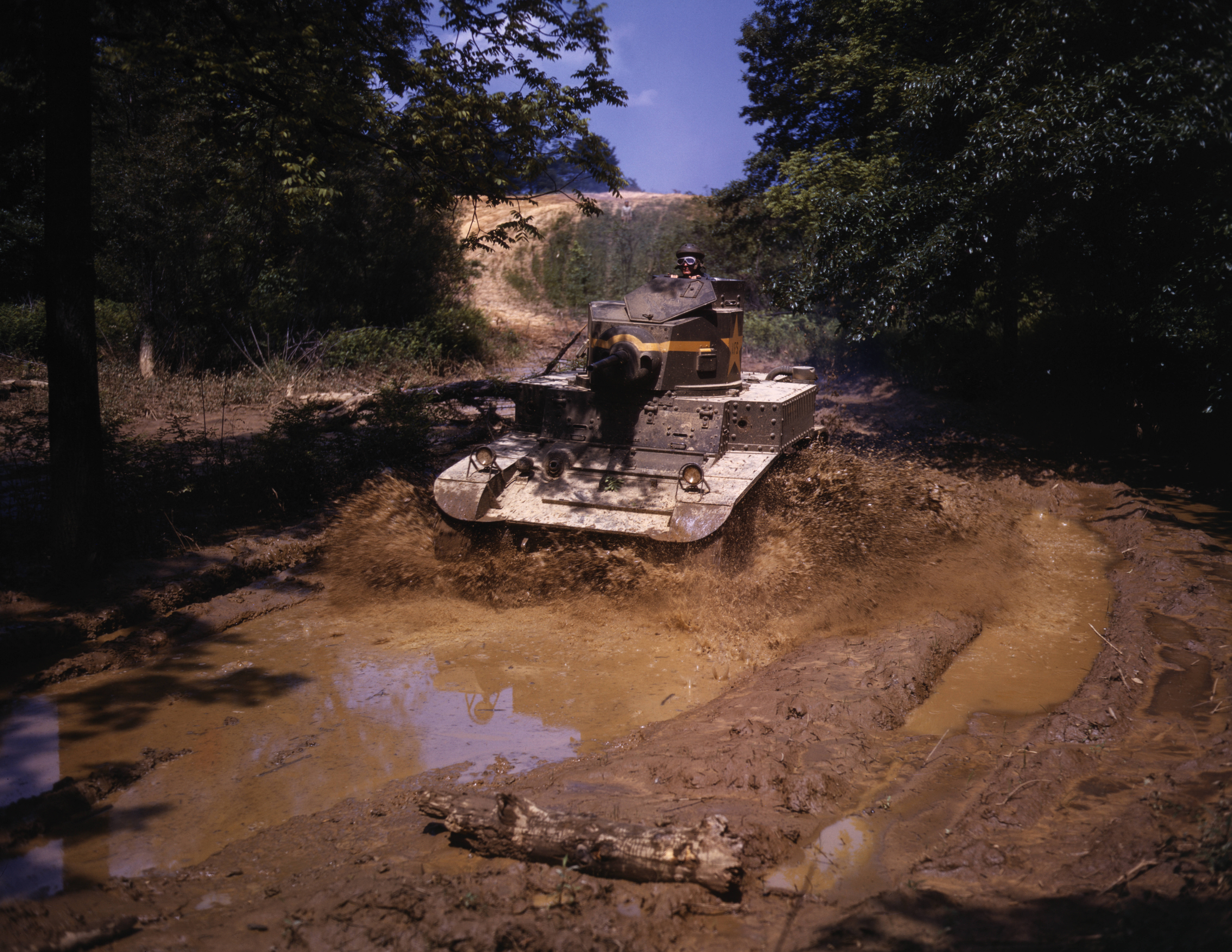 US Army M2 light tank traveling through mud obstacle, Fort Knox, Kentucky, United States, Jun 1942