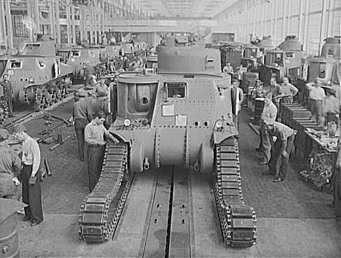 Workers putting tracks onto a M3 tank at the Detroit Arsenal Tank Plant, Warren, Michigan, United States, circa 1940-1942, photo 1 of 2