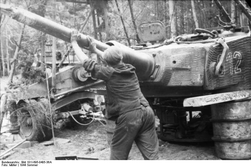 German Army Tiger I heavy tank under repair in a camouflaged repair facility, Russia, summer 1944, photo 2 of 2
