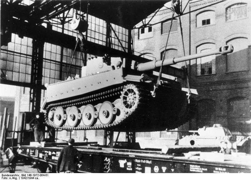 A newly bulit Tiger I heavy tank being loaded onto a rail car at the Henschel factory in Kassel, Germany, 1942-1944