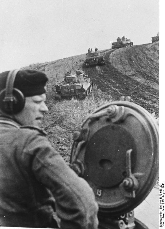 German Tiger I heavy tanks climbing a hill on the front lines near Belgorod, Russia, 13 Aug 1943