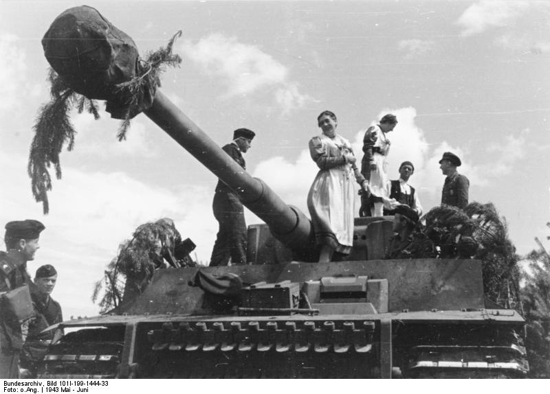 Local women visiting the crew of a German Tiger I heavy tank, Bryansk, Russia, May-Jun 1943