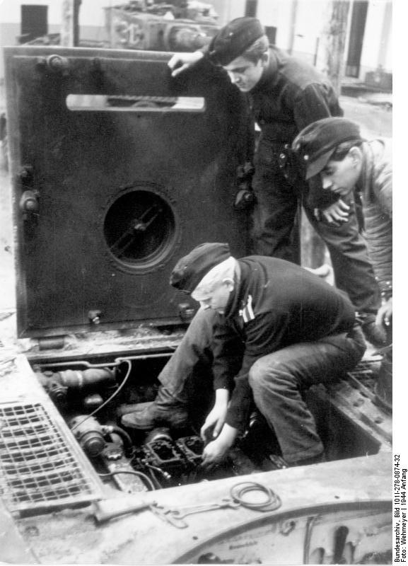German tankers performing repair or maintenance on the engine of a Tiger I heavy tank, Russia, early 1944