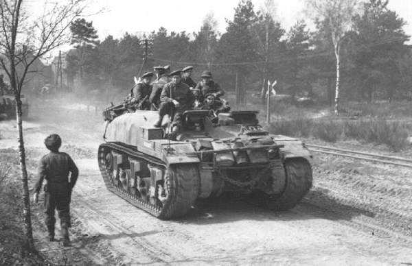 Soldiers of The Argyll and Sutherland Highlanders of Canada aboard a Kangaroo armored personnel carrier converted from a Ram tank, Europe, 11 Apr 1945
