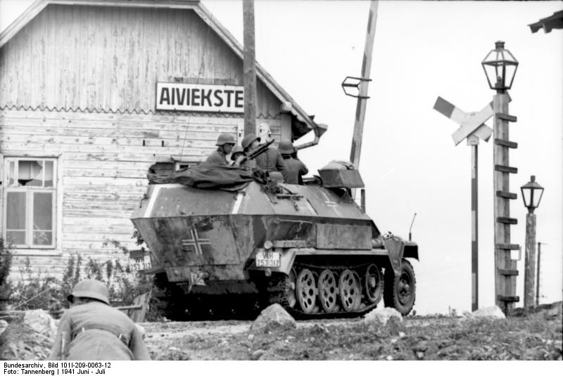 German SdKfz. 251/1 halftrack vehicle at a rail crossing, Aiviekstes, Latvia, Jun 1941
