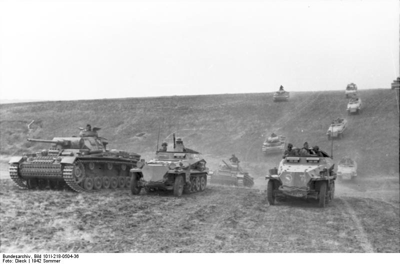 Panzer III tanks and SdKfz. 251 halftrack vehicles of the German 23rd Panzer Division on the move in Southern Russia, 21 Jun 1942