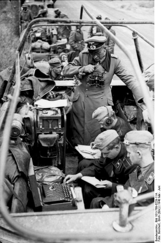 German General Heinz Guderian in a SdKfz. 251/3 halftrack vehicle, France, May 1940, photo 2 of 6; note early 3-rotor Enigma machine