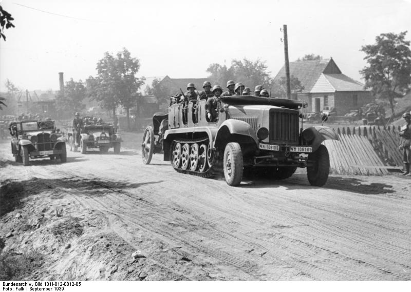 German SdKfz. 6 half-track vehicle towing a howitzer and carrying troops in Poland, Sep 1939