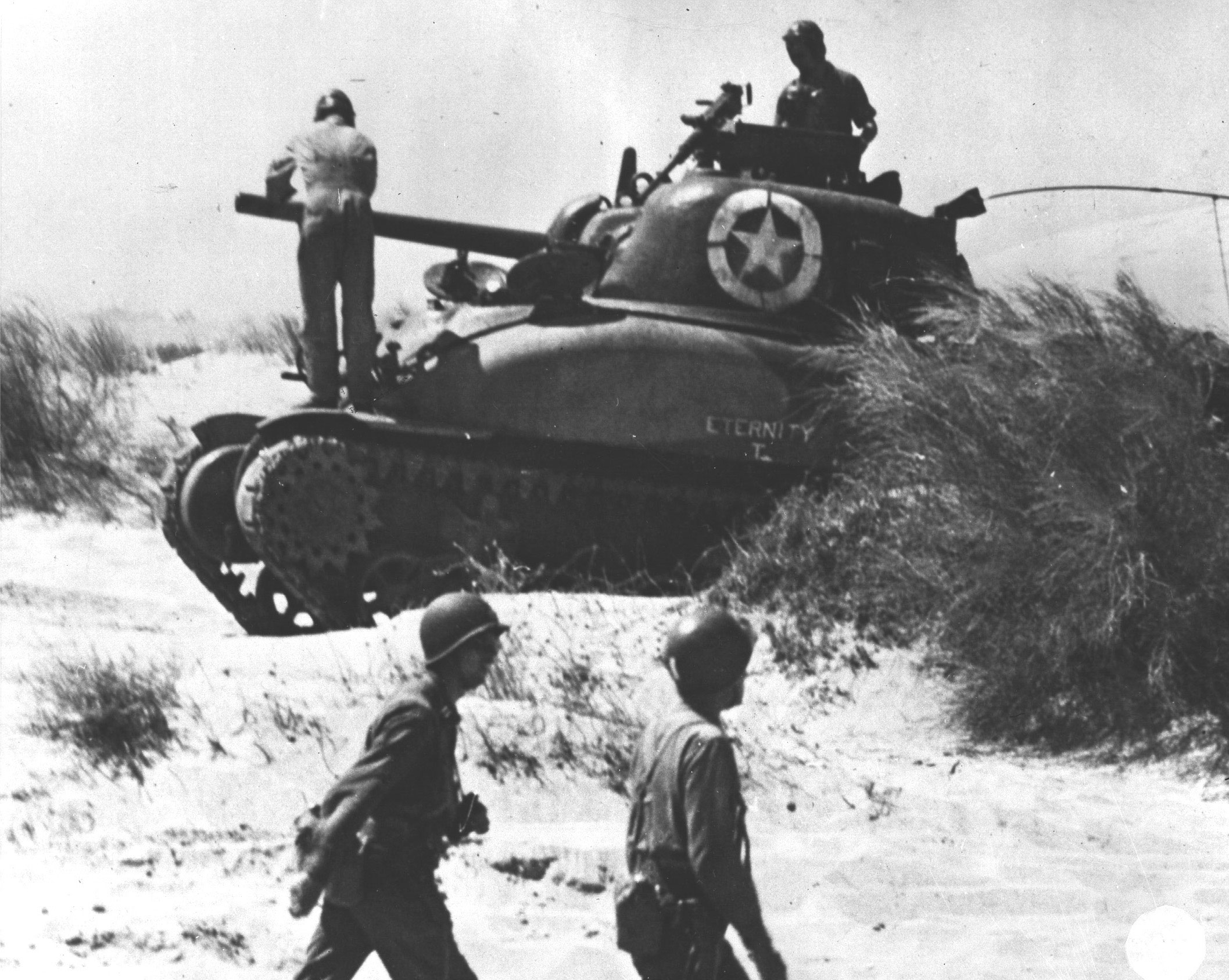 Crew of M4 Sherman tank 'Eternity' checking the tank after landing at Red Beach 2, Sicily, 10 Jul 1943