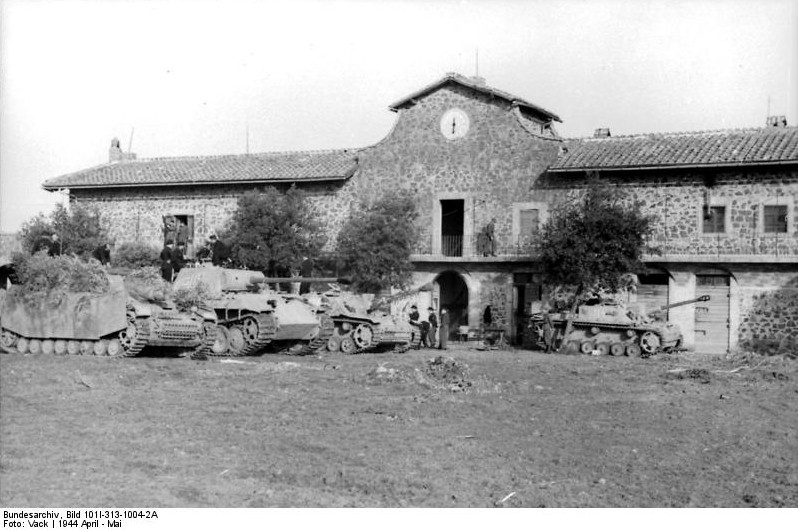 Camouflaged Sturmpanzer, Panzer V Panther, and two Sturmgeschütz III vehicles, Italy, Apr-May 1944