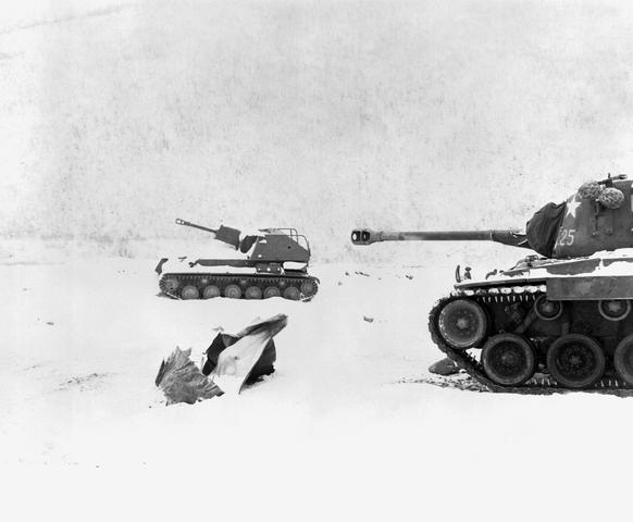US Marine Corps M26 Pershing heavy tank near an abandoned North Korean SU-76 self-propelled gun, Korea, 3 Dec 1950