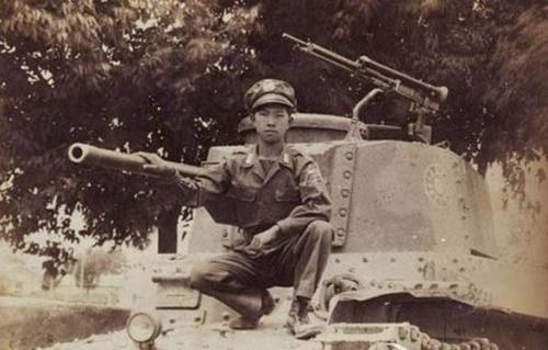 Chinese soldier posing with a captured Japanese Type 97 Shinhoto Chi-Ha medium tank, China, 1940s